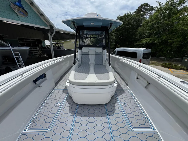 Slide: The Image of 2022 Invincible 33 Catamaran with sleek deck design and comfortable seating. - 21