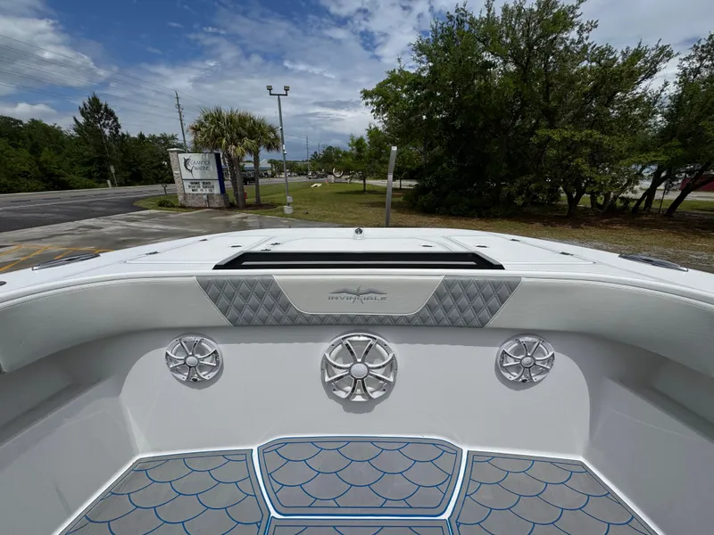 Slide: The Image of 2022 Invincible 33 Catamaran boat interior with speakers and patterned flooring. - 23