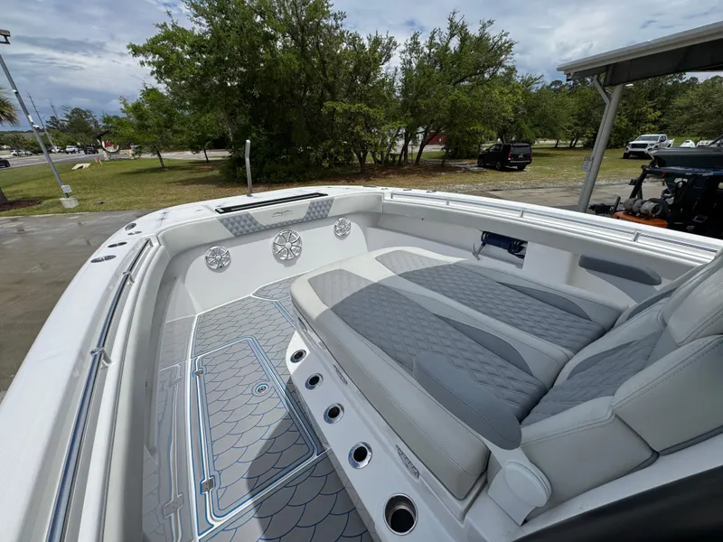 Slide: The Image of 2022 Invincible 33 Catamaran interior with cushioned seating and sleek design. - 24