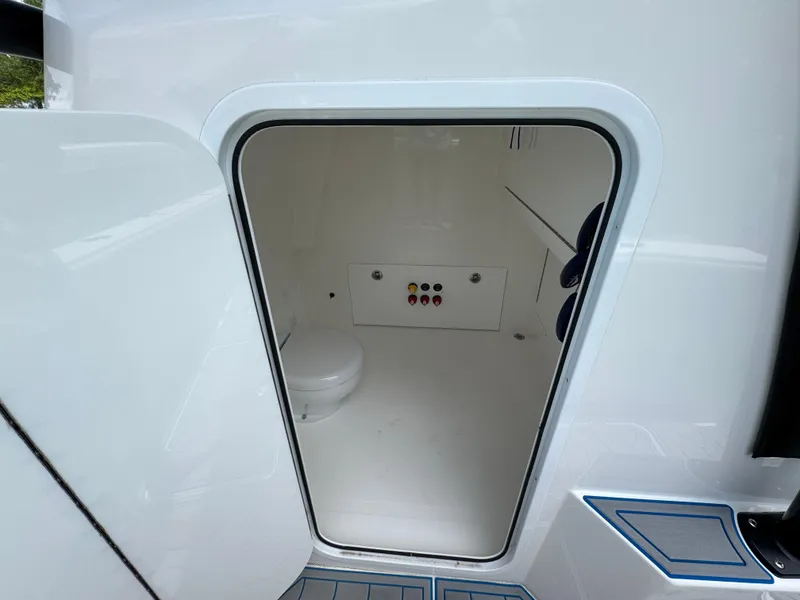 Slide: The Image of Interior view of 2022 Invincible 33 Catamaran's compact bathroom space. - 29