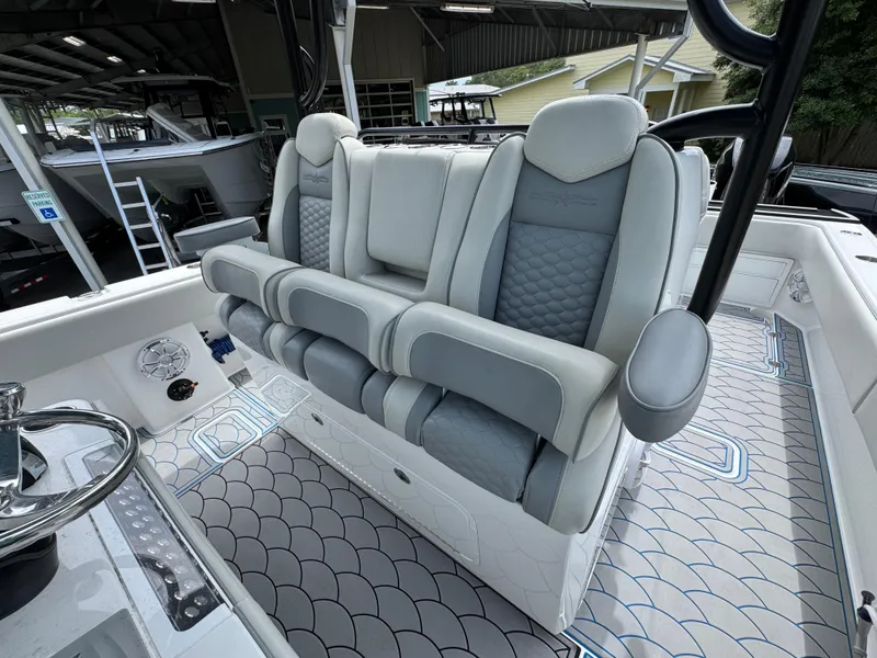 Slide: The Image of 2022 Invincible 33 Catamaran interior with luxurious seating and modern design. - 30