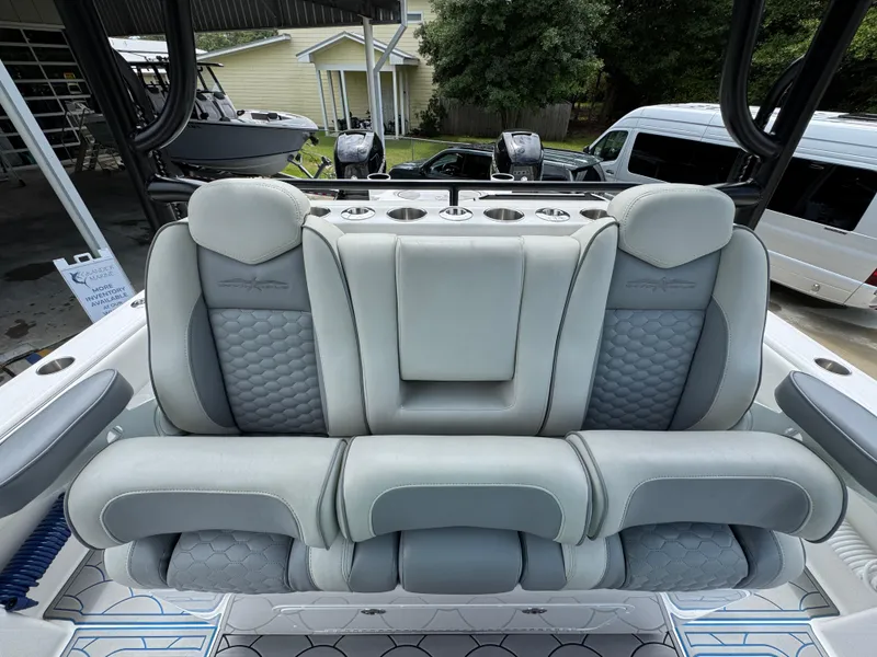 Slide: The Image of Luxurious seating on 2022 Invincible 33 Catamaran, featuring plush gray upholstery and modern design. - 31