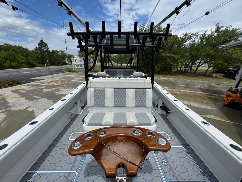 Slide: The Image of 2022 Invincible 33 Catamaran interior with seating and fishing rod holders. - 36