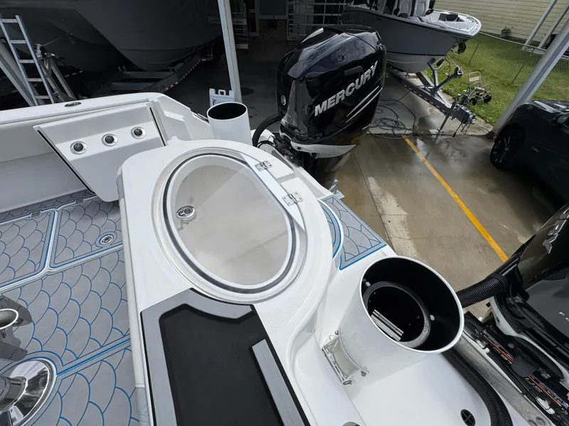 Slide: The Image of 2022 Invincible 33 Catamaran with Mercury engine, featuring a sleek deck and modern design. - 41
