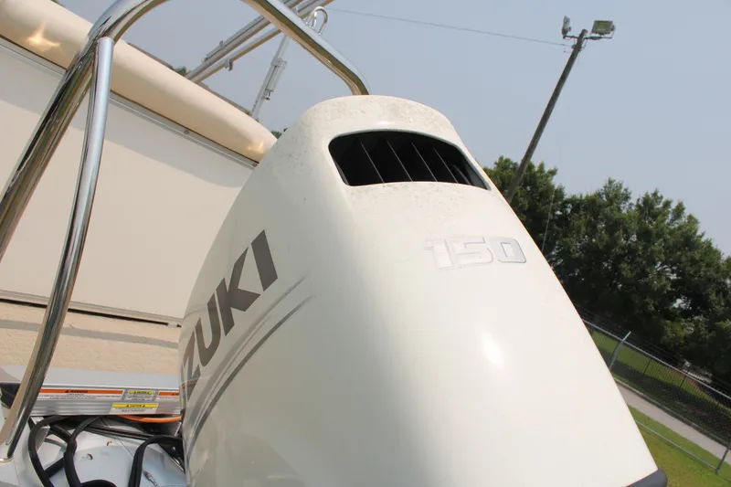 Slide: The Image of Outboard motor on 2021 Tahoe LTZ Cruise boat, featuring Suzuki branding. - 13