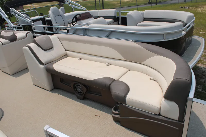 Slide: The Image of 2021 Tahoe LTZ Cruise pontoon boat with beige and brown seating on deck. - 3