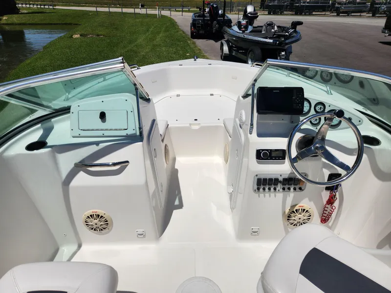 Slide: The Image of 2014 Tidewater 196 DC boat interior with steering wheel and dashboard controls. - 11