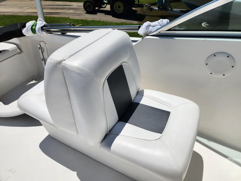 Slide: The Image of White and gray seat on 2014 Tidewater 196 DC boat, outdoor setting. - 14