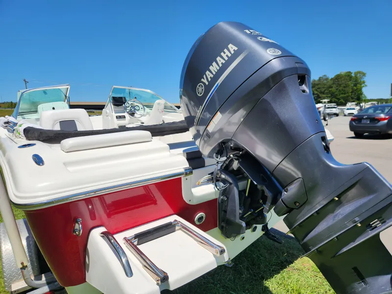Slide: The Image of 2014 Tidewater 196 DC boat with Yamaha outboard motor, red and white exterior. - 3