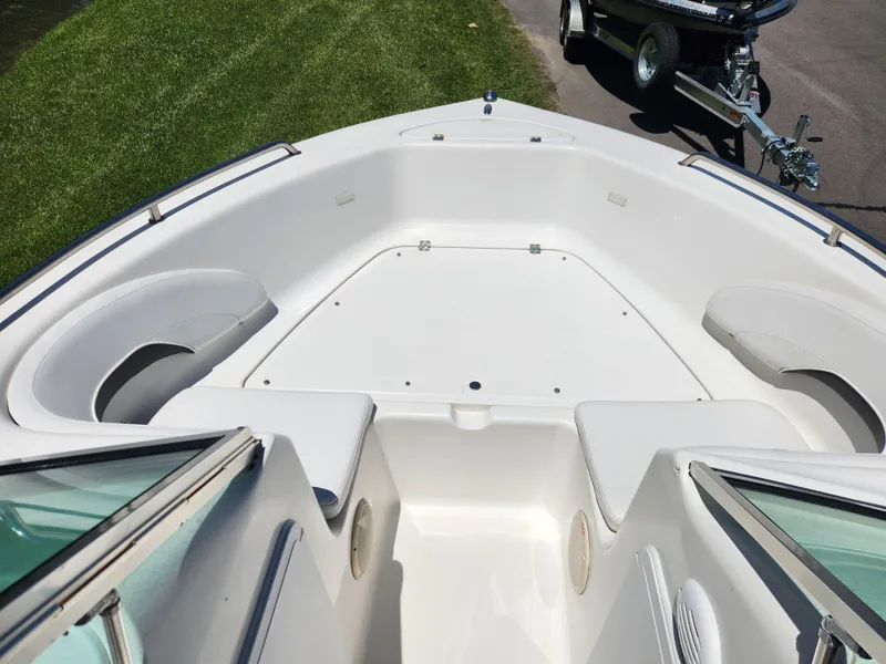 Slide: The Image of 2014 Tidewater 196 DC boat interior with spacious seating and storage compartments. - 8