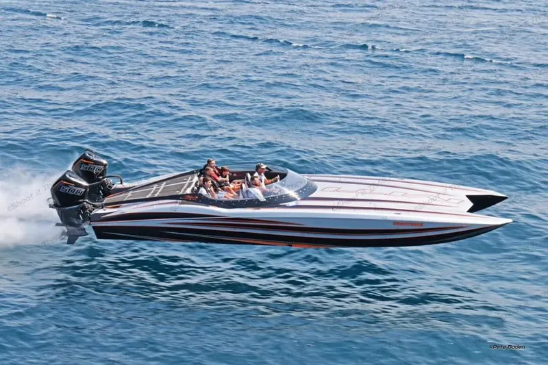 The Image of 2018 MTI 340X speedboat cruising on open water with passengers. - 1