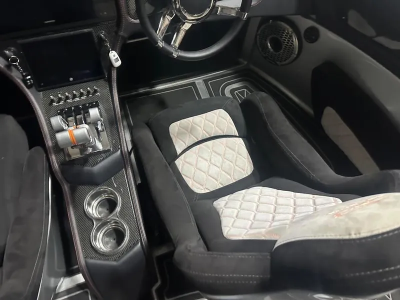 Slide: The Image of Luxurious MTI 340X 2018 interior with quilted seats, carbon fiber accents, and advanced controls. - 12