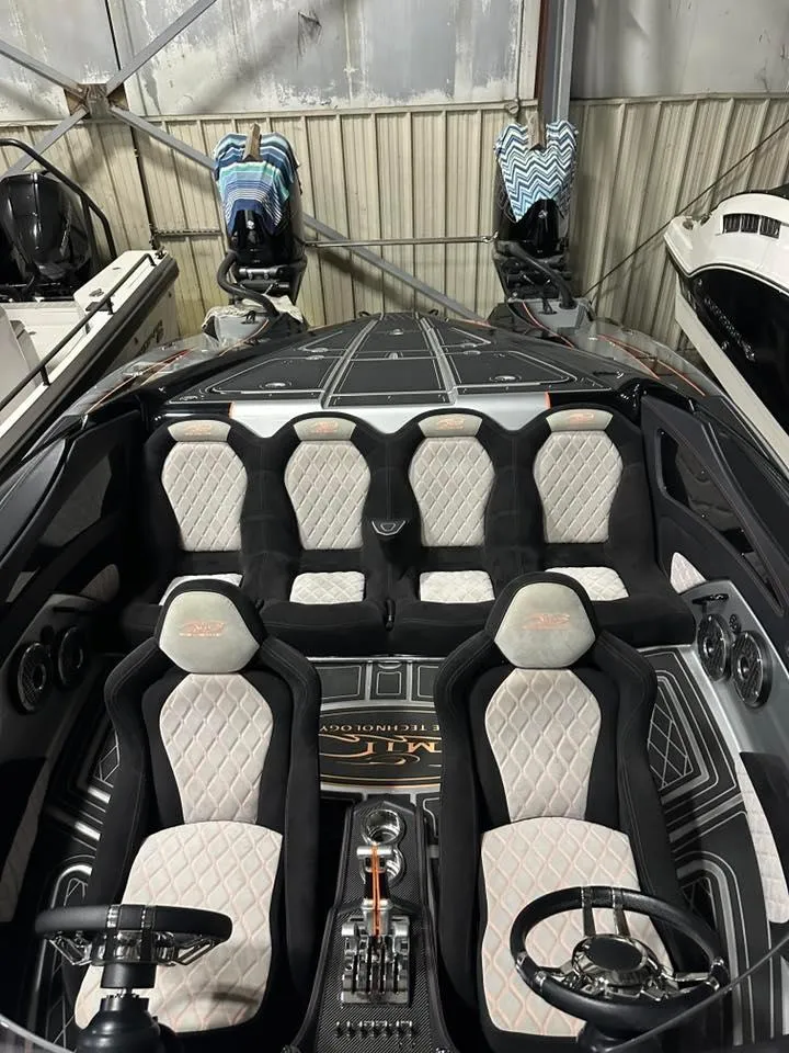 Slide: The Image of Luxury MTI 340X 2018 speedboat interior with plush seating and sleek design. - 14