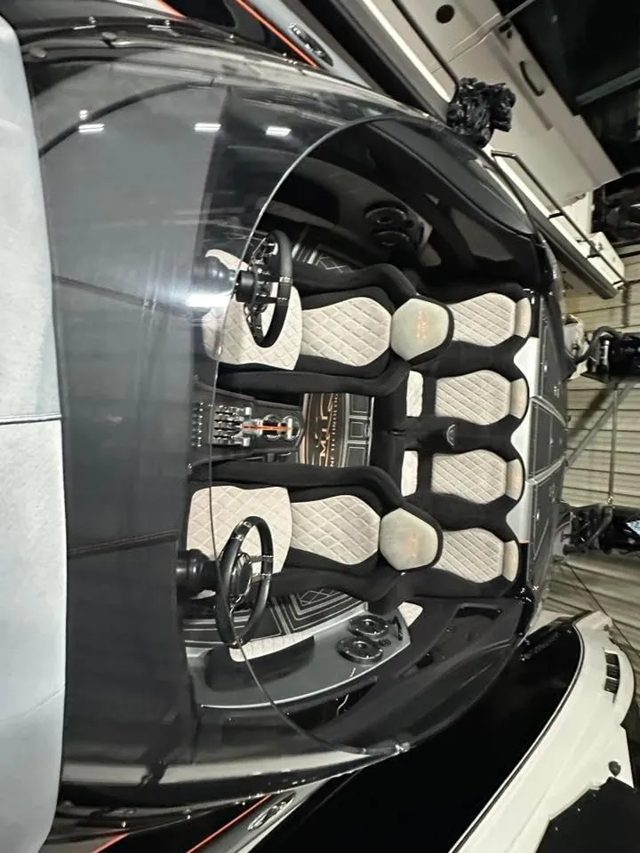 Slide: The Image of 2018 MTI 340X boat interior with sleek design and modern seating arrangement. - 18