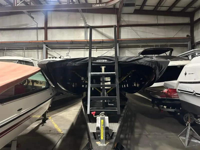 Slide: The Image of 2018 MTI 340X boat stored indoors, covered, with ladder access. - 5
