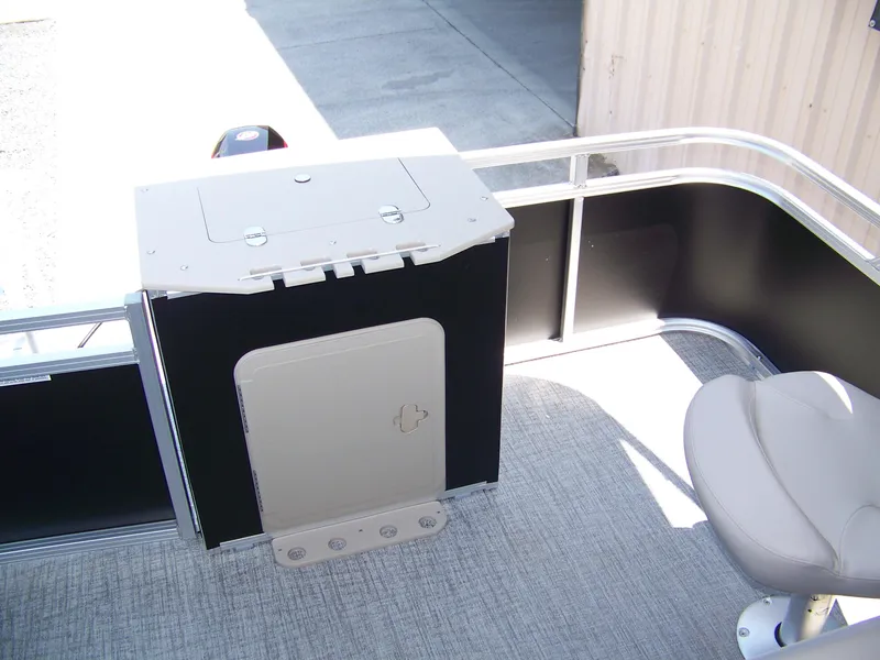 Slide: The Image of 2025 Avalon VTX Quad Fish boat interior with seating and storage compartment. - 12