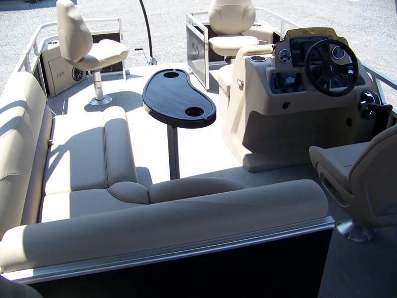 Slide: The Image of Interior of 2025 Avalon VTX Quad Fish boat with seating and steering console. - 13