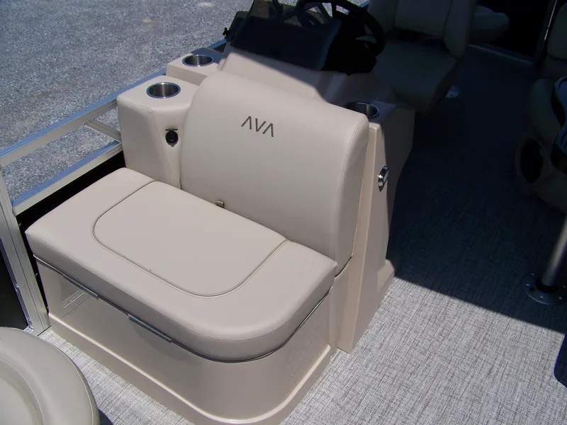 Slide: The Image of 2025 Avalon VTX Quad Fish boat interior with beige seating and cup holders. - 5