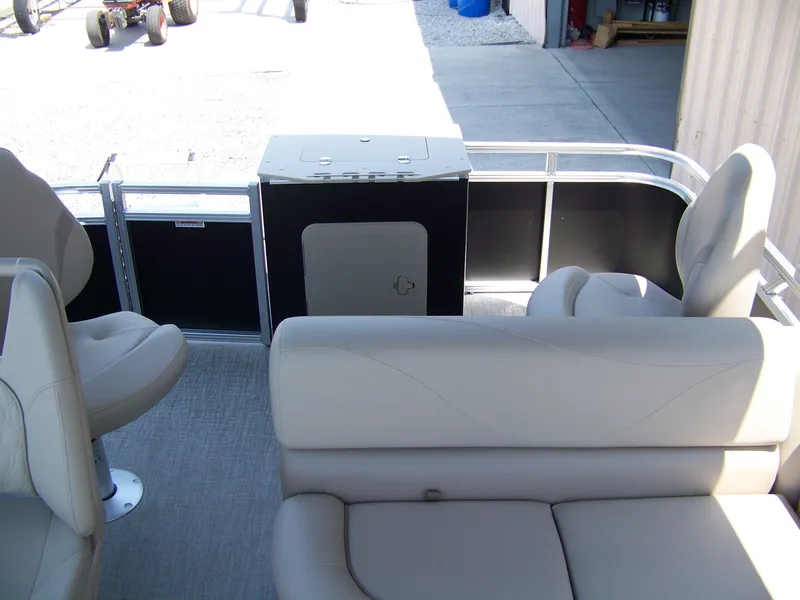 Slide: The Image of Interior of 2025 Avalon VTX Quad Fish pontoon boat with beige seating. - 8