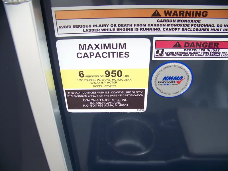 Slide: The Image of 2025 Avalon Venture Rear Fish capacity label, warning of carbon monoxide and propeller injury risks. - 10