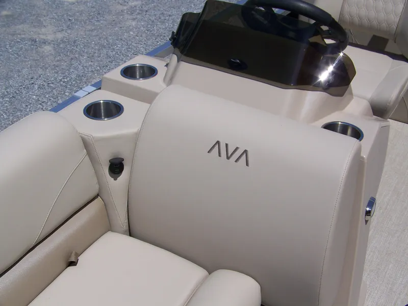 Slide: The Image of 2025 Avalon VLS Quad Lounge interior with beige seating and cup holders. - 5