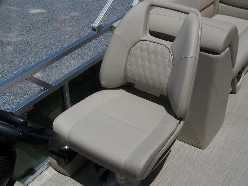 Slide: The Image of 2025 Avalon VLS Quad Lounge boat seat with beige upholstery and modern design. - 9