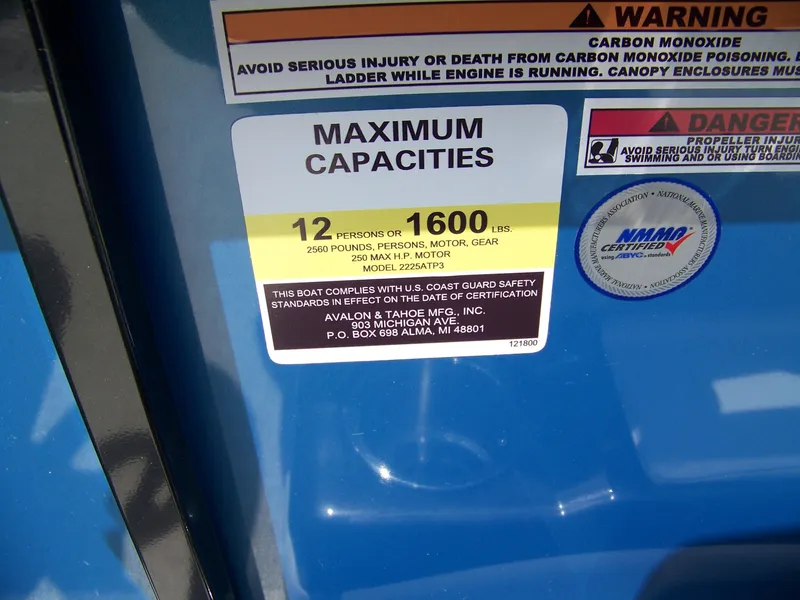 Slide: The Image of 2025 Avalon VENTURE 85 CRUISE capacity label, 12 persons or 1600 lbs, safety warnings. - 10