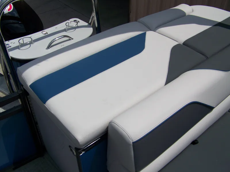Slide: The Image of 2025 Avalon VENTURE 85 CRUISE boat seating with blue, white, and gray upholstery. - 12