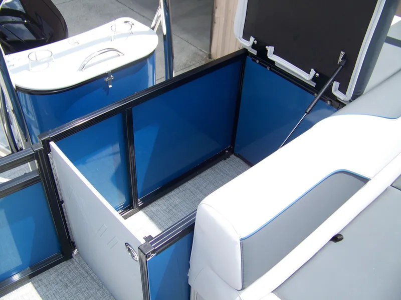 Slide: The Image of 2025 Avalon VENTURE 85 CRUISE interior storage compartment with blue panels and white seating. - 13