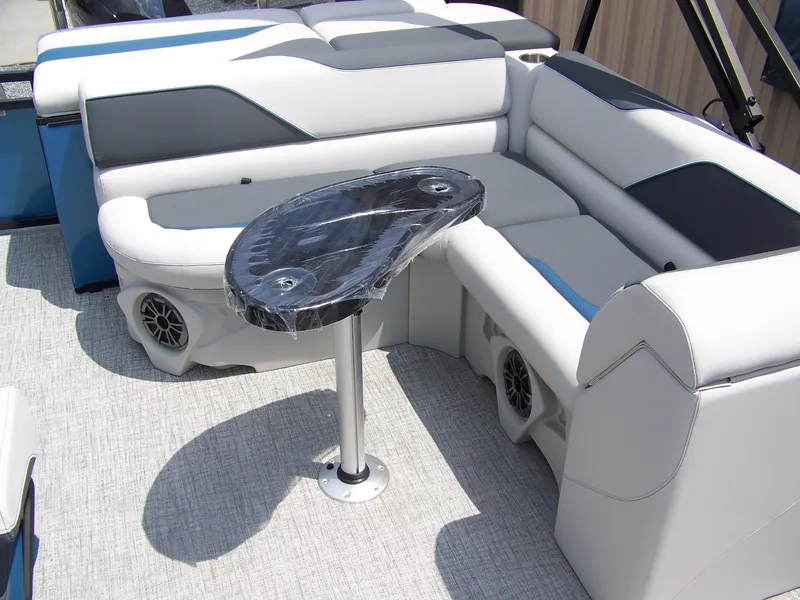 Slide: The Image of Luxurious seating area on 2025 Avalon VENTURE 85 CRUISE pontoon boat with sleek table design. - 7