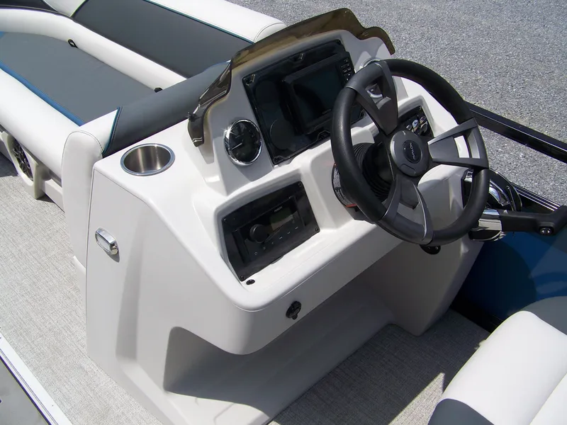 Slide: The Image of 2025 Avalon VENTURE 85 CRUISE boat dashboard with steering wheel and controls. - 8