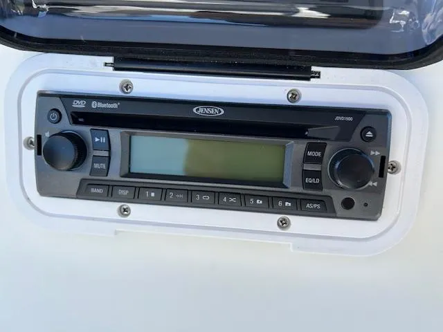 Slide: The Image of Jensen stereo system on 2003 Aquasport 250 Osprey boat dashboard. - 15