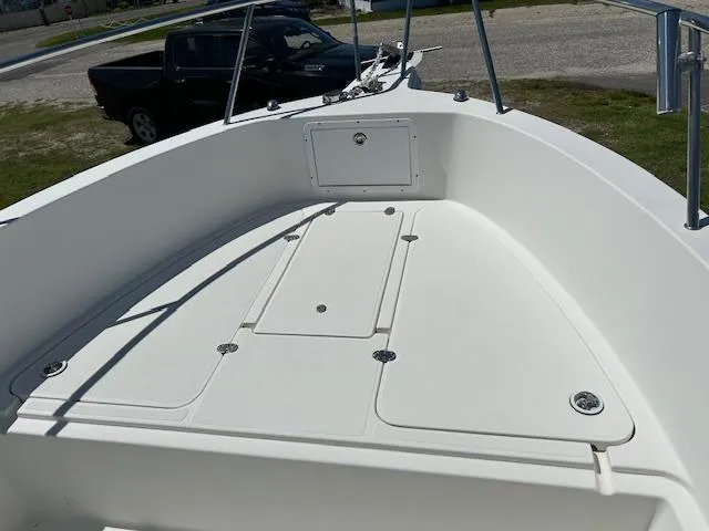 Slide: The Image of 2003 Aquasport 250 Osprey boat deck, featuring storage compartments and railing. - 4