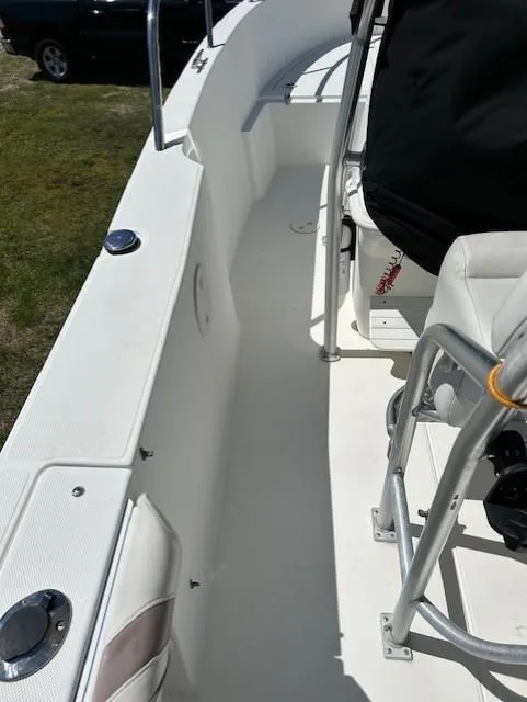 Slide: The Image of 2003 Aquasport 250 Osprey boat interior with seating and console. - 9