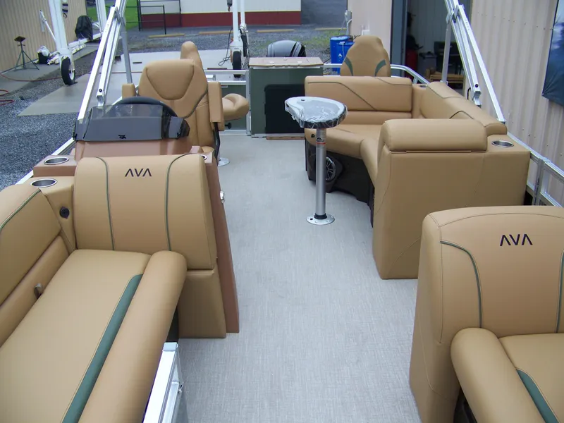 Slide: The Image of 2025 Avalon Venture Rear Fish boat interior with tan seating and modern design. - 4