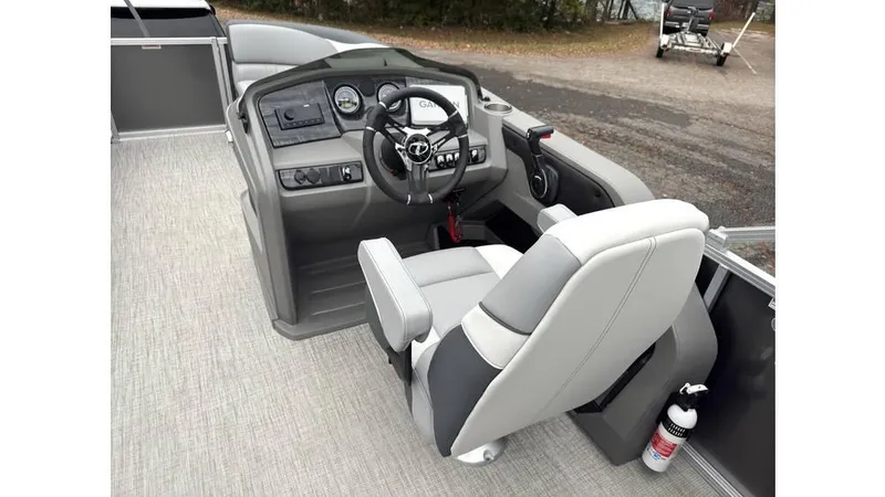 Slide: The Image of 2025 Tahoe Pontoon LTZ Quad Lounger helm with modern steering and controls. - 8