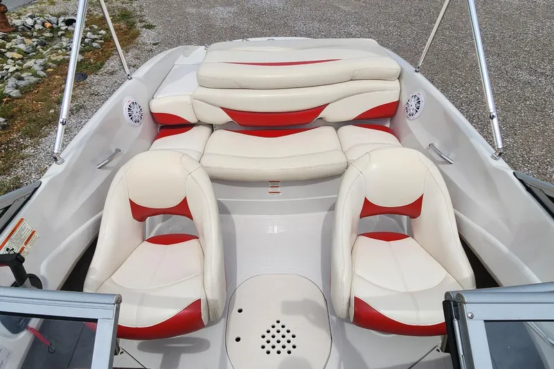 Slide: The Image of 2013 Tahoe Q5i boat interior with white and red seating. - 8