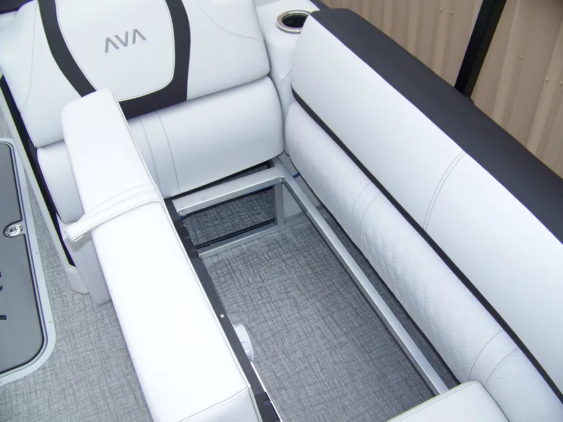 Slide: The Image of 2025 Avalon Catalina Cruise Rear Bench Windshield with white cushioned seating and storage compartment. - 5