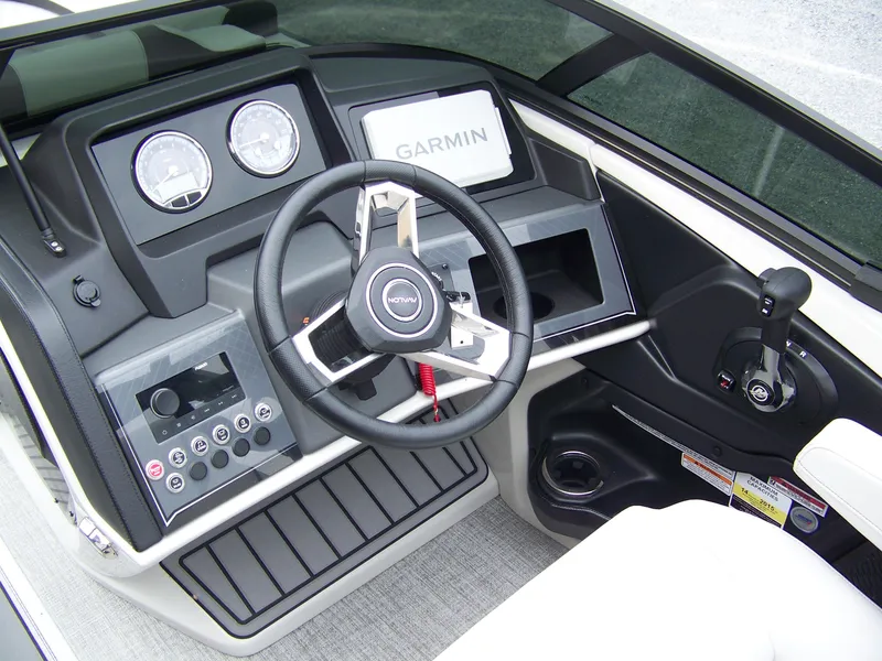 Slide: The Image of 2025 Avalon Catalina Cruise dashboard with steering wheel and Garmin display. - 6