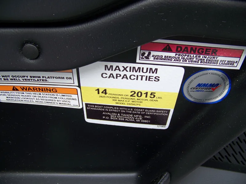 Slide: The Image of 2025 Avalon Catalina Cruise capacity label, 14 persons or 2015 lbs, safety warnings visible. - 7