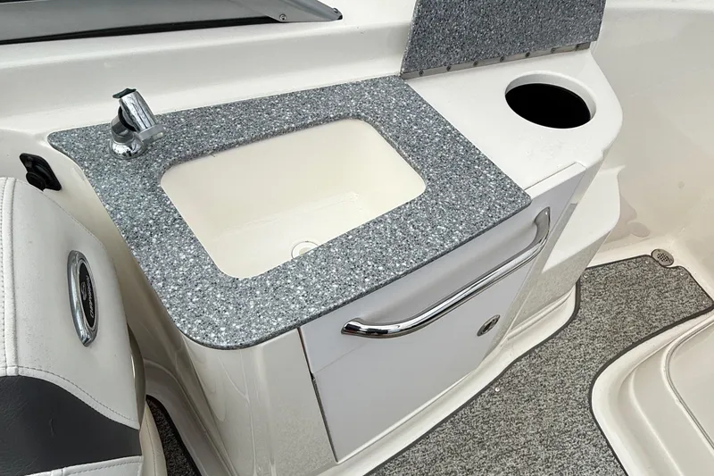 Slide: The Image of 2015 Chaparral 244 Sunesta boat interior with sink and countertop. - 10