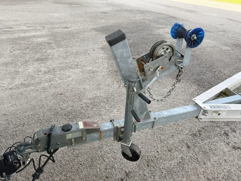 Slide: The Image of Trailer hitch and winch for 2015 Chaparral 244 Sunesta boat on asphalt surface. - 13