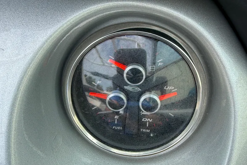 Slide: The Image of Gauge panel of 2015 Chaparral 244 Sunesta boat showing fuel and trim levels. - 22