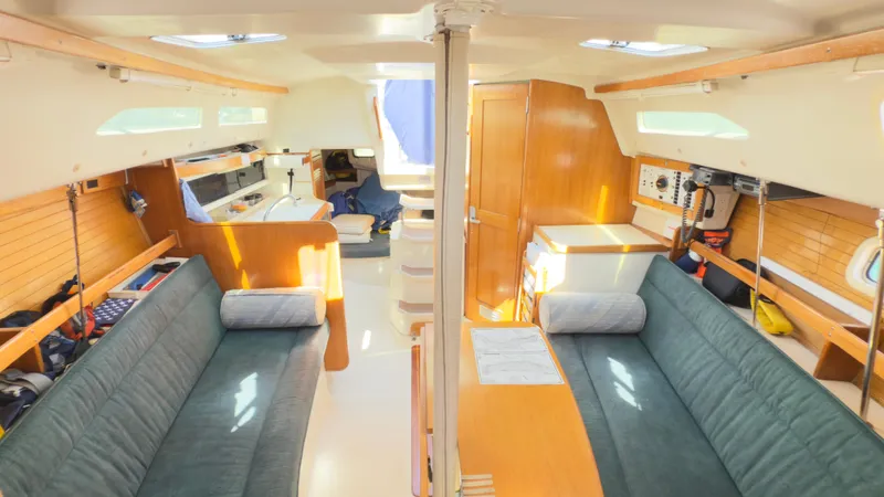 Slide: The Image of Interior of a 1998 Catalina 28 MkII sailboat with cozy seating and wooden finishes. - 11