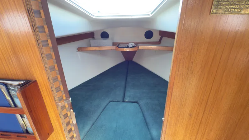 Slide: The Image of Interior cabin of 1998 Catalina 28 MkII sailboat with cozy sleeping area. - 12
