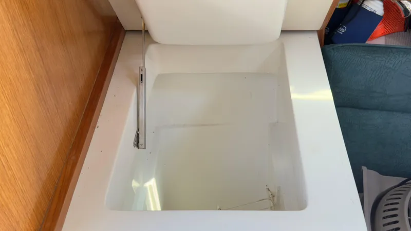 Slide: The Image of Open storage compartment in 1998 Catalina 28 MkII sailboat interior. - 14