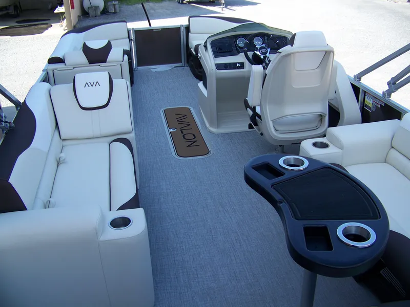 Slide: The Image of Luxurious interior of 2025 Avalon LSZ Elite pontoon boat with plush seating and modern helm. - 11