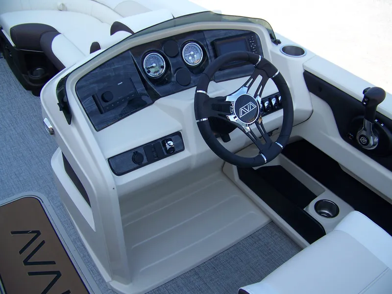 Slide: The Image of 2025 Avalon LSZ ELITE boat dashboard with steering wheel and controls. - 8