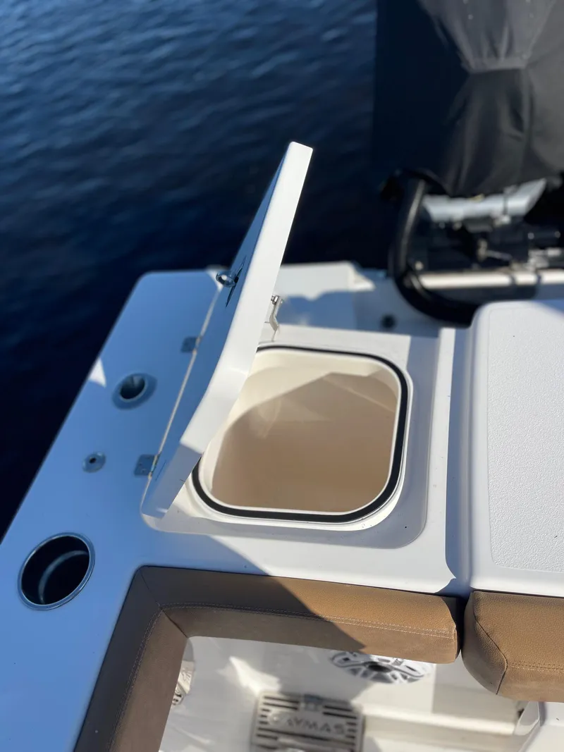Slide: The Image of 2022 Caymas 341 CC boat with open storage compartment on deck. - 13