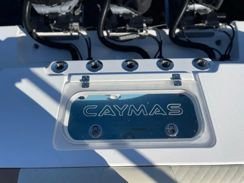 Slide: The Image of Caymas 341 CC 2022 boat dashboard with logo and control panel. - 14